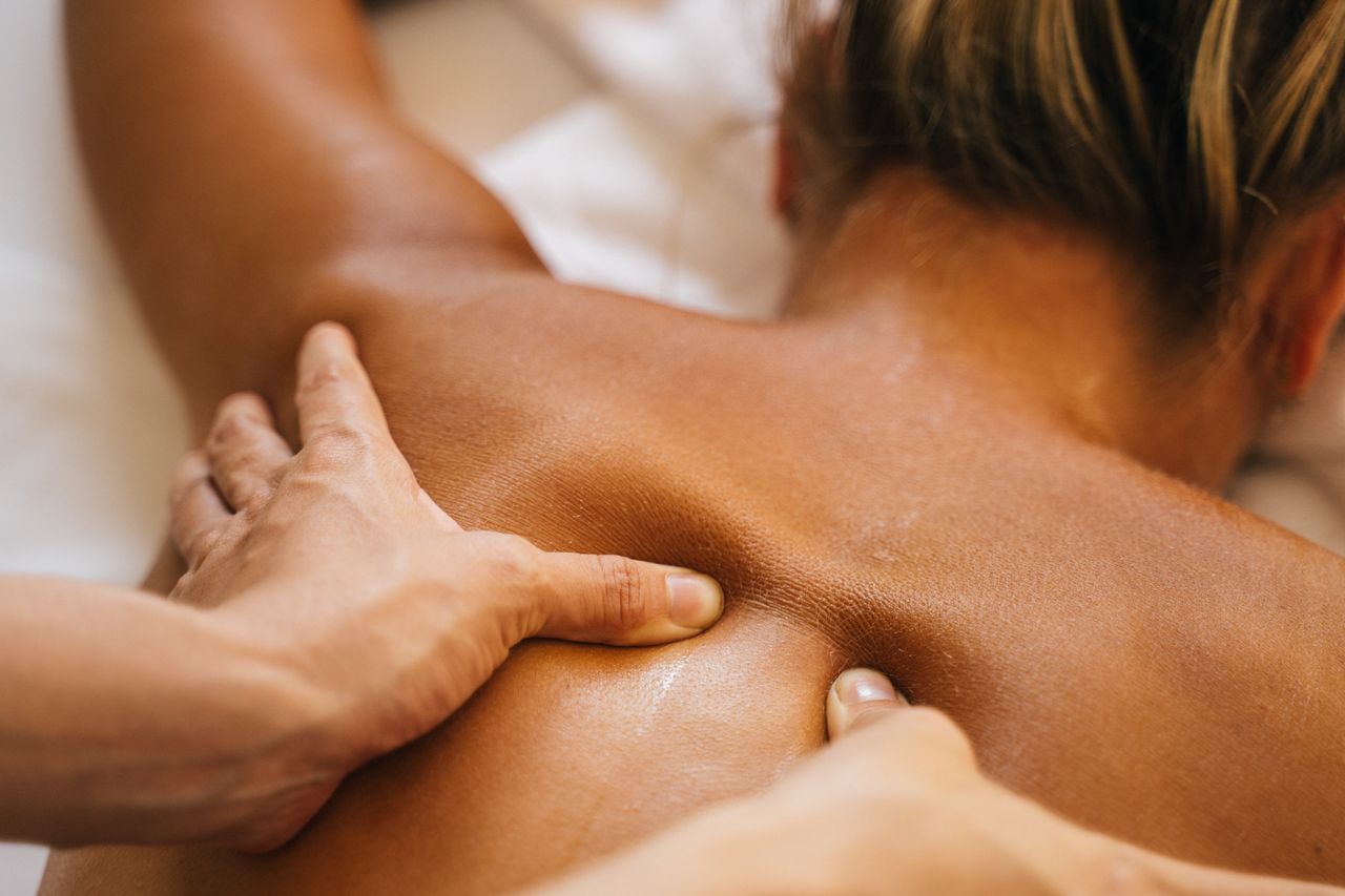 services-01 Close-up of a soothing back massage, promoting relaxation and wellness.