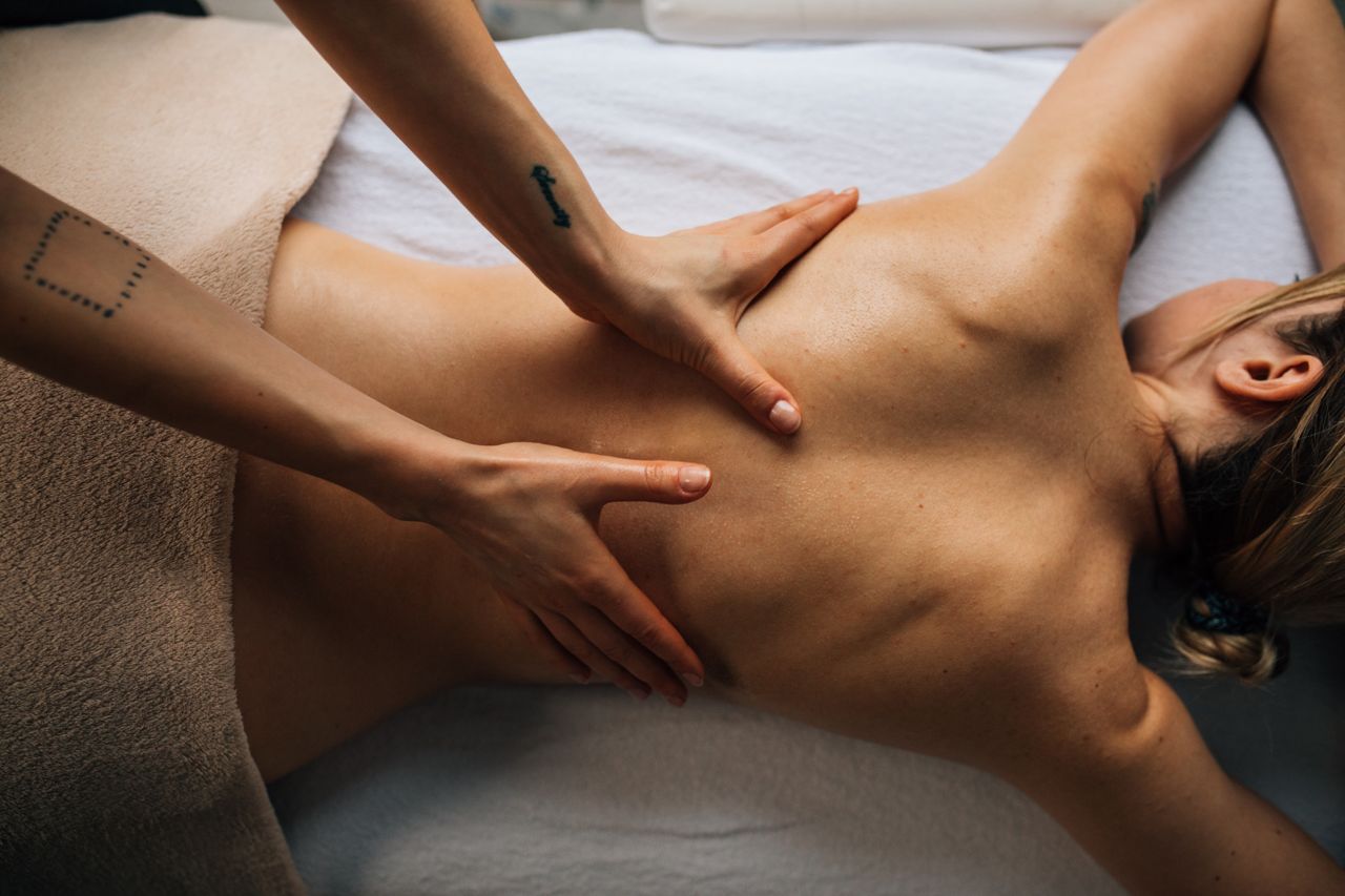 hero-img-01 A relaxing massage therapy session with a focus on wellness and self-care indoors.